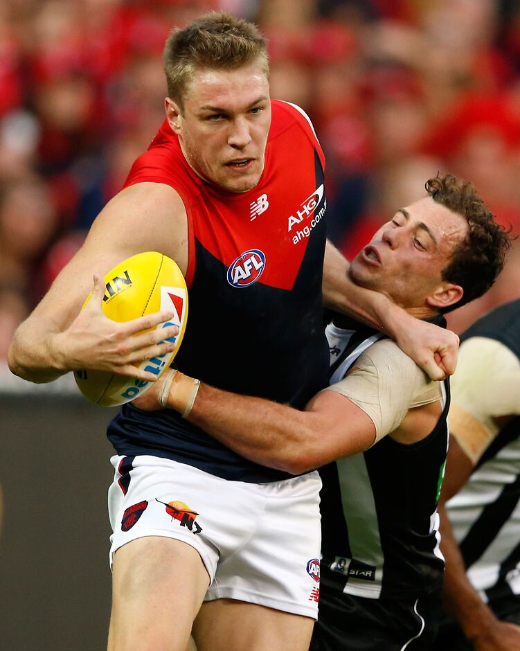 AFL 2016 Rd 04 - Collingwood v Melbourne MELBOURNE, AUSTRALIA - APRIL 17: Tom McDonald of the Demons is tackled by Jarryd Blair of the Magpies during the 2016 AFL Round 04 match between the Collingwood Magpies and the Melbourne Demons at the Melbourne Cricket Ground, Melbourne on April 17, 2016. (Photo by Adam Trafford/AFL Media)